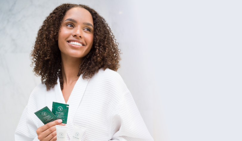 a lady holding Vi peel product